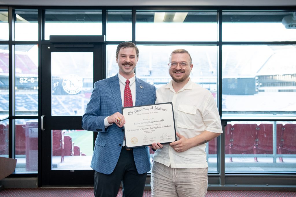 Dr. Lucas Tarvainen with Dr. Russ Guin, assistant residency director and clinical assistant professor of sports medicine in the Department of Family, Internal, and Rural Medicine. 